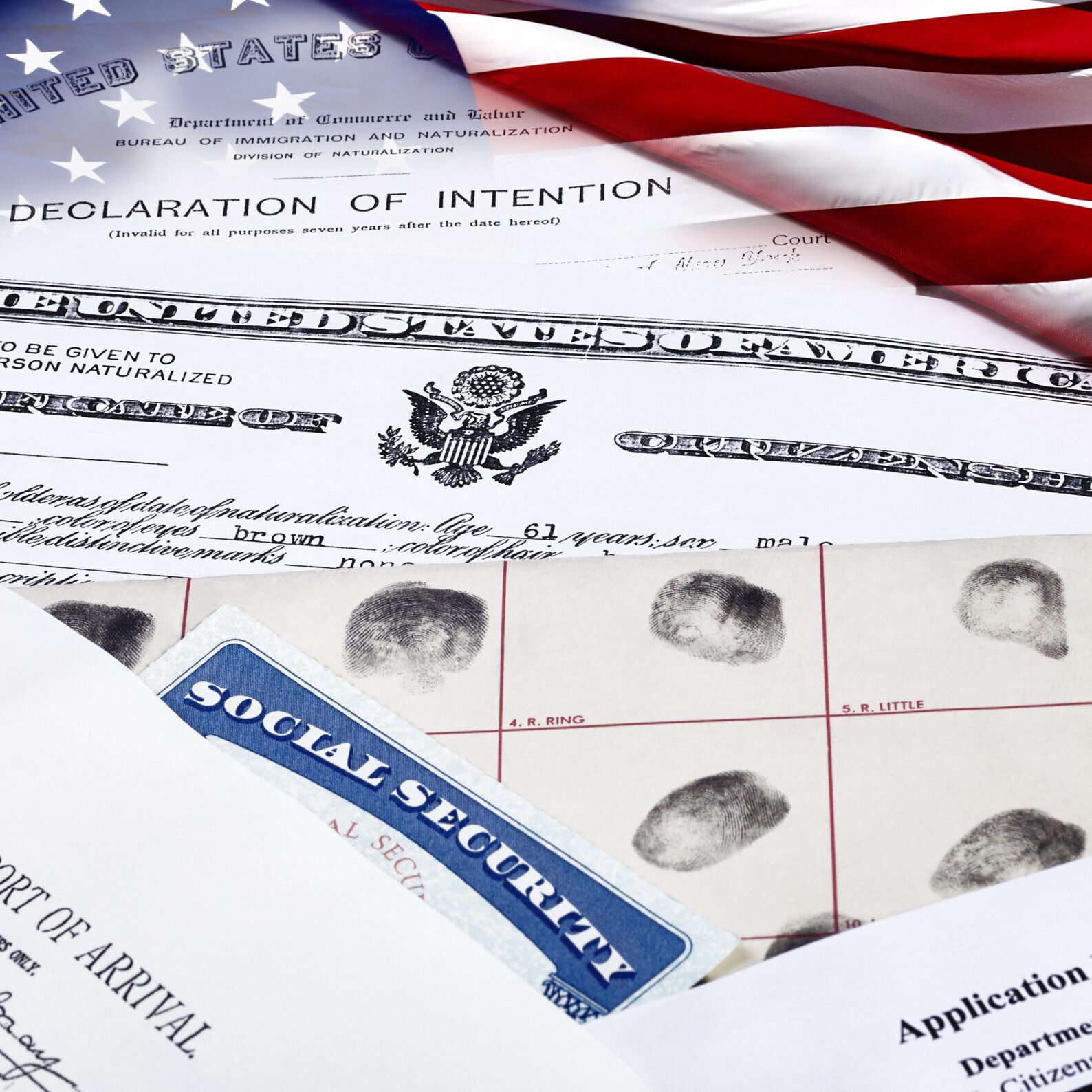 US Certificate of Citizenship, declaration of intention, fingerpirnt card, social security card, application for naturalization and port of arrival manifest with red, white and blue ribbon